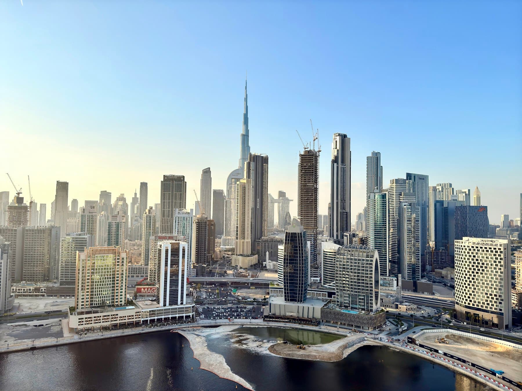 Dubai Creek with traditional dhow boats and the city skyline behind